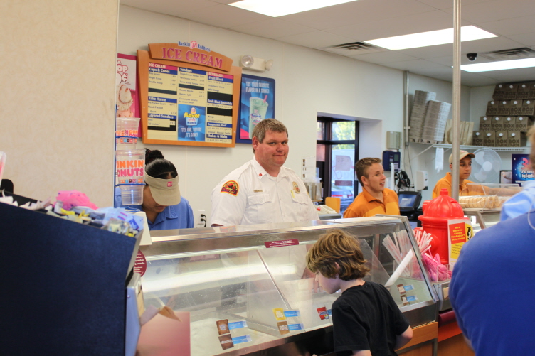 A firefighter at Baskin Robbins 31 Cent Scoop Night
